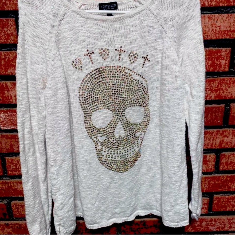 Long oversized knitted felt sweater with diamond skull and heart designs 
US 4